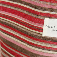 Close-up of striped fabric with a visible brand label.