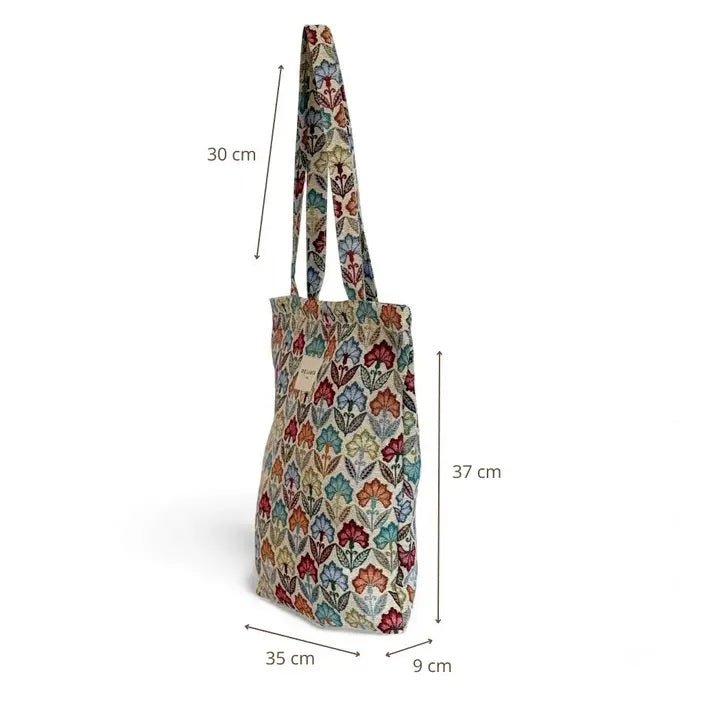 Multicolored patterned tote bag with dimensions indicated on a white background