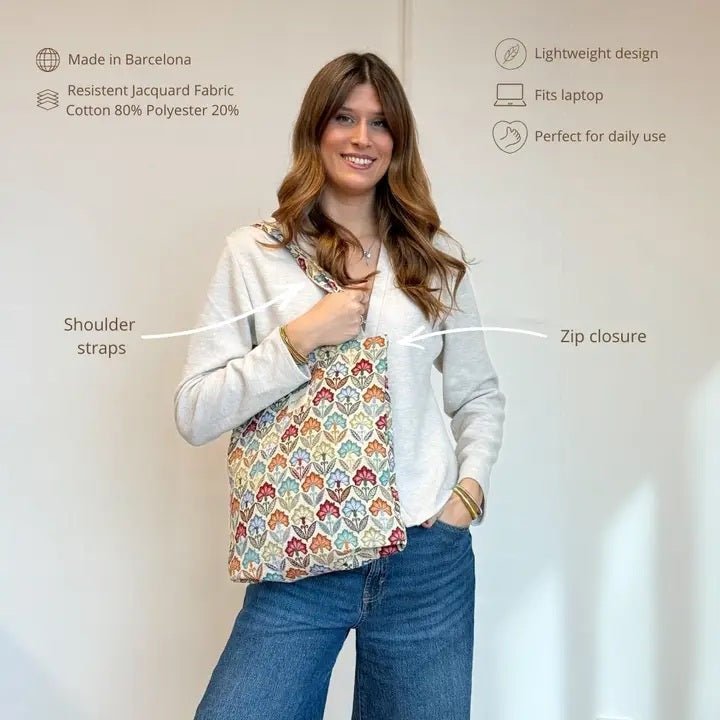 Woman holding a colorful patterned bag with text describing its features.