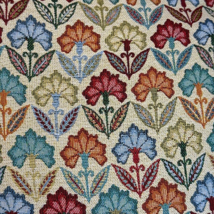 Patterned fabric with colorful floral design on a beige background