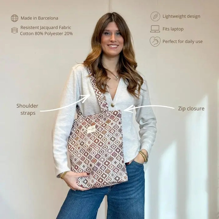 Woman holding a patterned tote bag with text describing its features.