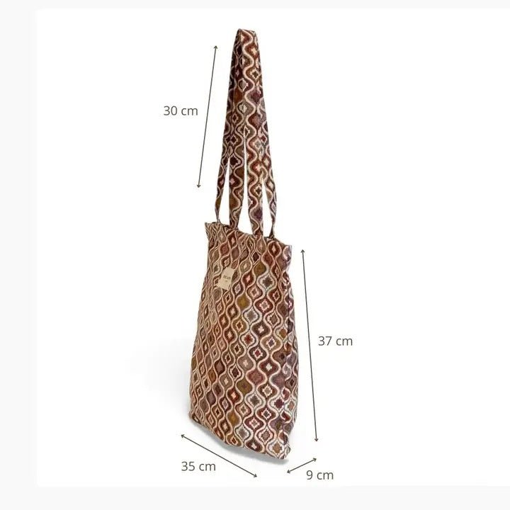 Patterned bag with dimensions marked on a white background